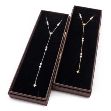 Collana girocollo in acciaio con pendente sogg. Stella e perle